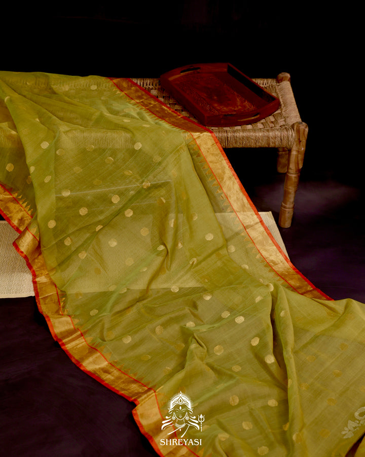 Ponduru Khadi Jamdani saree in olive green with handwoven jamdani motifs and contrast orange border