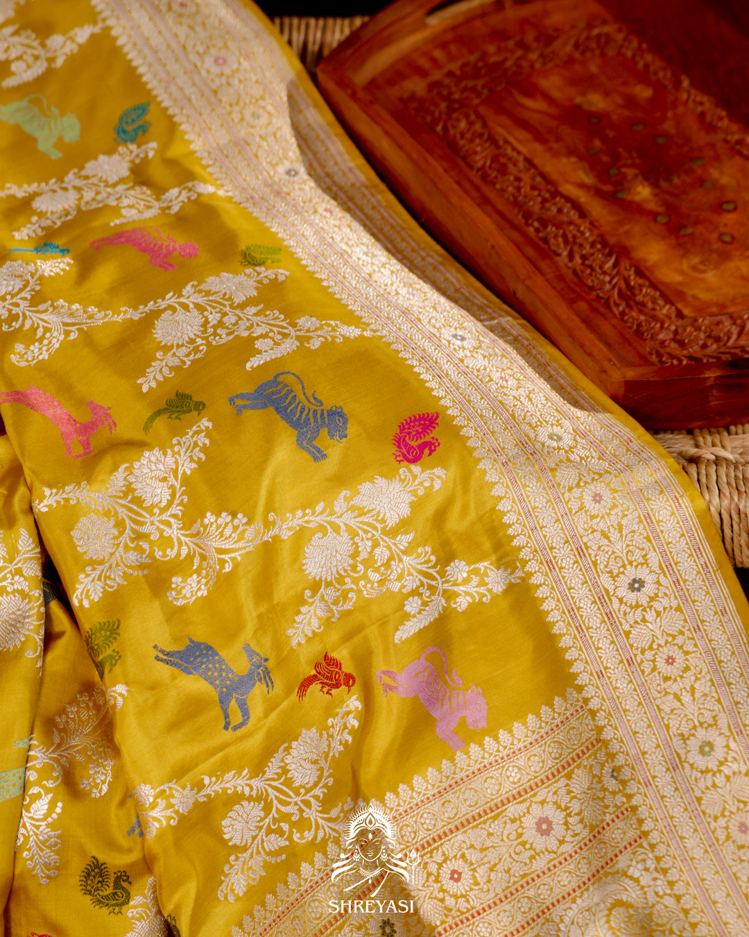 Banarasi Ektara silk saree in marigold yellow with kadhwa meenakari animal motifs and full zari border