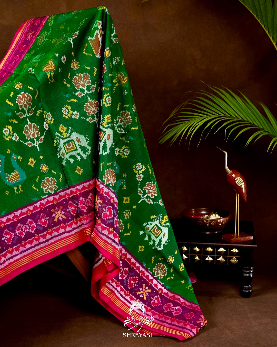 Handloom Pure Rajkot Patola Silk Saree in Emerald Green with Animal & Floral Ikat Motifs