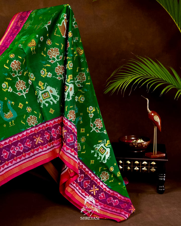 Handloom Pure Rajkot Patola Silk Saree in Emerald Green with Animal & Floral Ikat Motifs