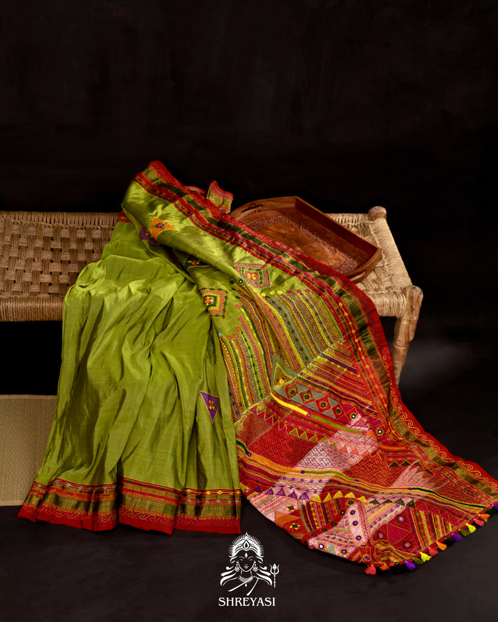 Handloom pure Ilkal silk saree featuring traditional Lambani embroidery with mirror work and geometric stitch patterns