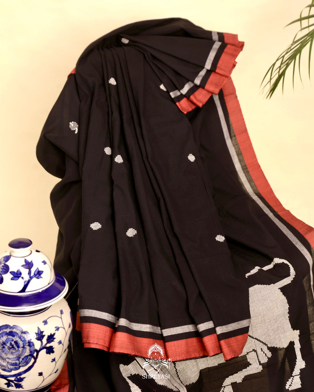 Handloom Bawan Buta cotton saree featuring traditional Jamdani woven motifs and contrast borders