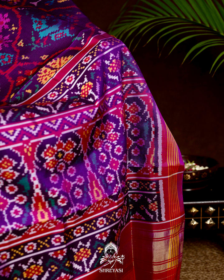 Handloom Pure Rajkot Patola Silk Saree with Animal & Floral Ikat Motifs