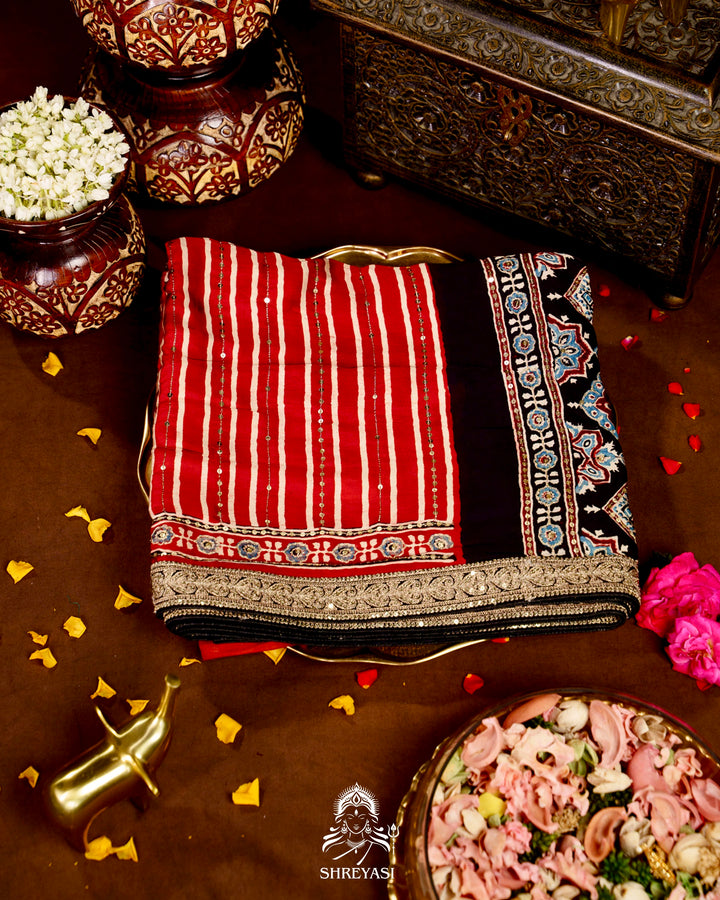 Handloom Pure Modal Silk Ajrakh Hand Block Printed Saree with Natural Dyes, All Over Aari Embroidery & Embroidered Borders