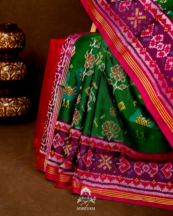 Handloom Pure Rajkot Patola Silk Saree in Emerald Green with Animal & Floral Ikat Motifs