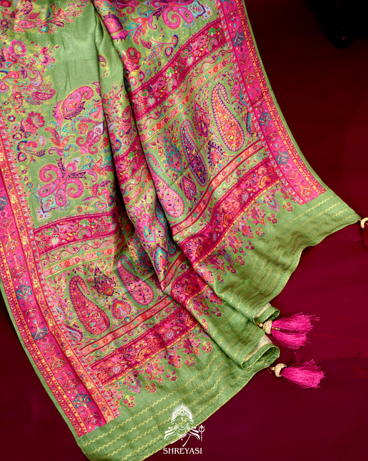 Kashmiri silk saree with multicolour floral and paisley motifs, woven border and pallu, paired with a floral blouse