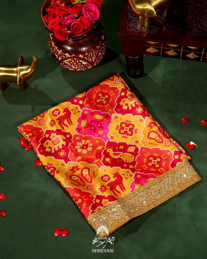 Pure Organza Silk Saree with Embellished Borders and Patola Print Silk Blouse