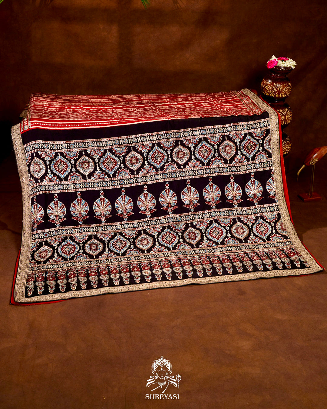 Handloom Pure Modal Silk Ajrakh Hand Block Printed Saree with Natural Dyes, All Over Aari Embroidery & Embroidered Borders