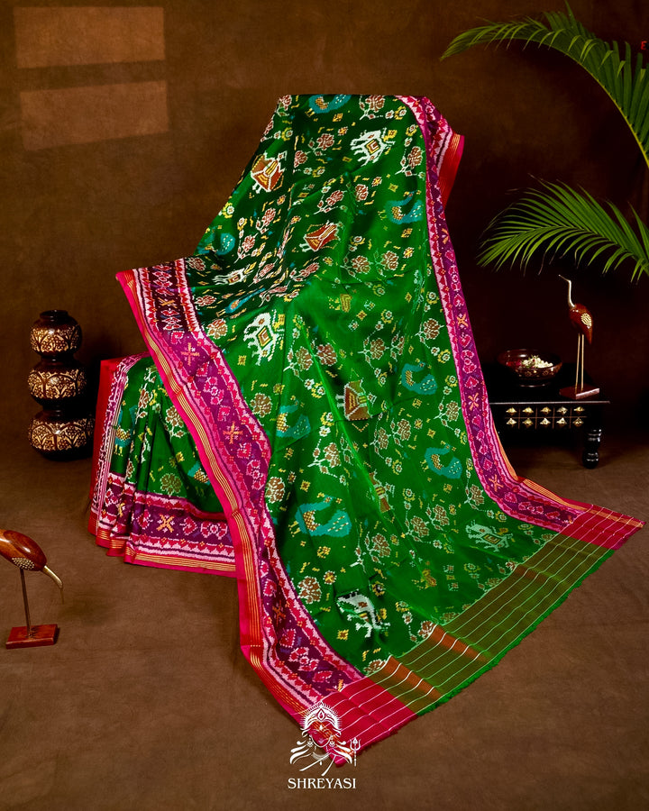 Handloom Pure Rajkot Patola Silk Saree in Emerald Green with Animal & Floral Ikat Motifs