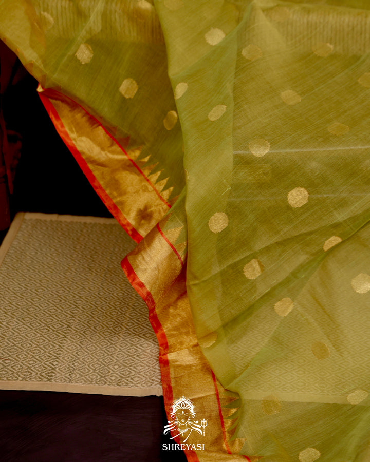 Ponduru Khadi Jamdani saree in olive green with handwoven jamdani motifs and contrast orange border