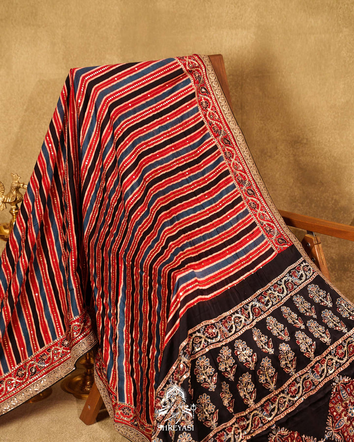 Handloom Pure Modal Silk Ajrakh Hand Block Printed Saree with Natural Dyes, All Over Aari Embroidery & Embroidered Borders