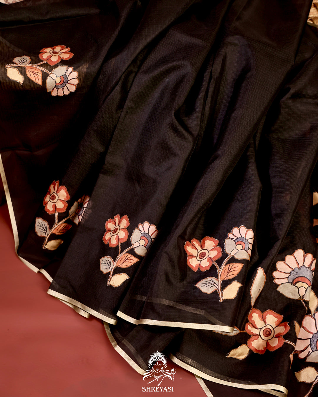 Kota saree with floral kalamkari appliqué work, contrast border, and lightweight breathable drape